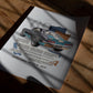 Unframed 1969 Chevrolet Camaro collage art print lying on a wooden table in patterned sunlight.