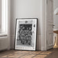 Framed Artemis II crew artwork displayed in an interior setting.