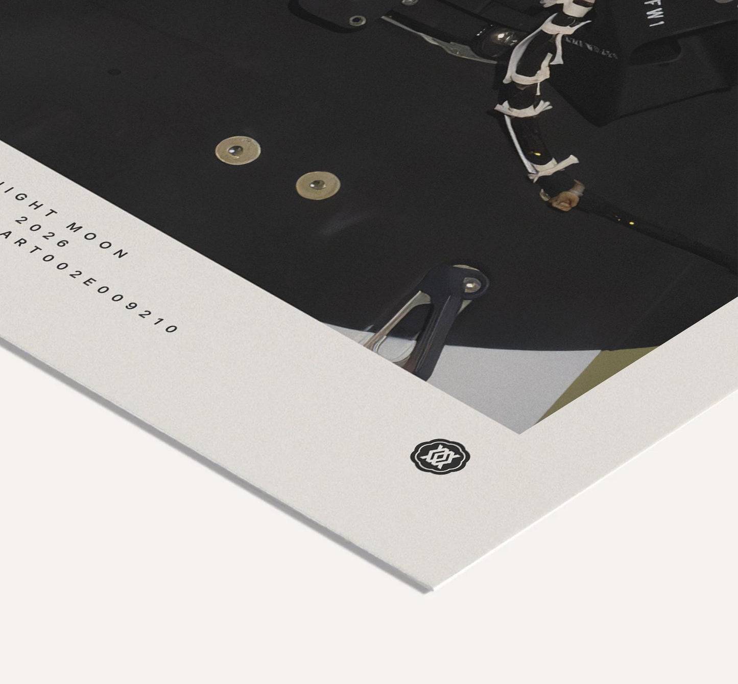 Close-up of an Artemis II Goodnight Moon art print corner showing spacecraft equipment, printed mission text, and a small emblem.