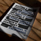 Unframed due process art print listing landmark legal cases in bold black and blue type on a sunlit wooden table.