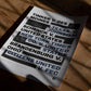 Unframed free speech legal cases typography art print lying on a wooden table beneath strong window shadows.