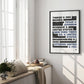 Black-framed free speech legal cases typography art print hanging in a sunlit bedroom beside tall windows.