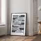 Black-framed due process artwork listing landmark legal cases, leaning against the wall in a bright paneled room.