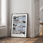 Black-framed women's rights legal cases artwork leaning beside a window and open doorway.