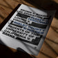 Unframed civil rights art print listing landmark court cases in black and blue type, lying in patterned sunlight on a wooden floor.