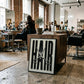 Black-framed HAIR artwork with silver scissors displayed against a cabinet in a hair salon.