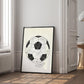 Black-framed 1930 World Cup opening match diagram artwork leaning beside a window and open doorway.