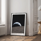 Framed Artemis II Earthset artwork displayed in an interior setting.