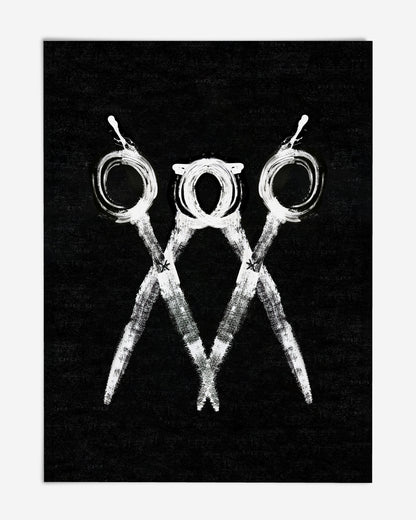 Unframed black and white artwork of three overlapping scissors on a textured black background.