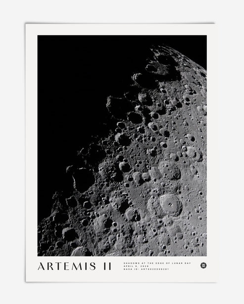 Unframed Artemis II art print featuring a black-and-white view of the Moon’s heavily cratered surface against deep black space.