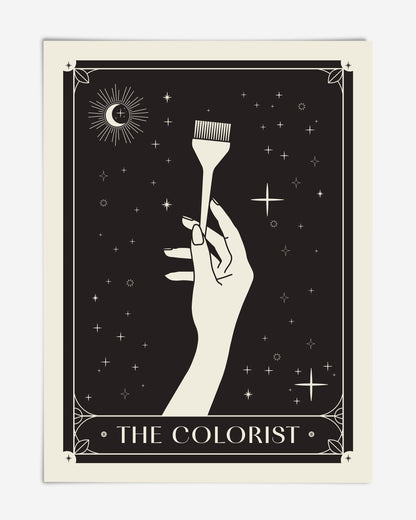 Unframed black-and-cream The Colorist art print featuring a hand holding a hair-coloring brush beneath a crescent moon and stars.