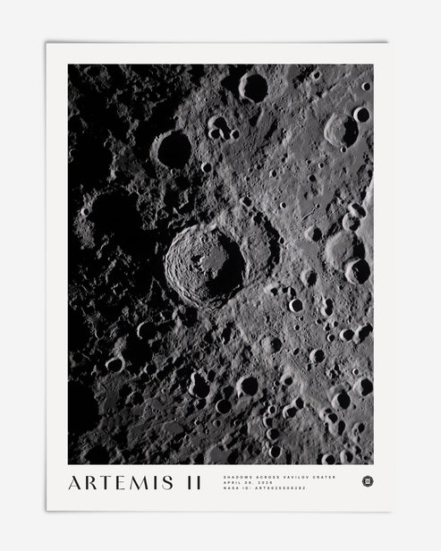 Unframed Artemis II Shadows Across Vavilov Crater art print featuring a high-contrast view of the cratered lunar surface.