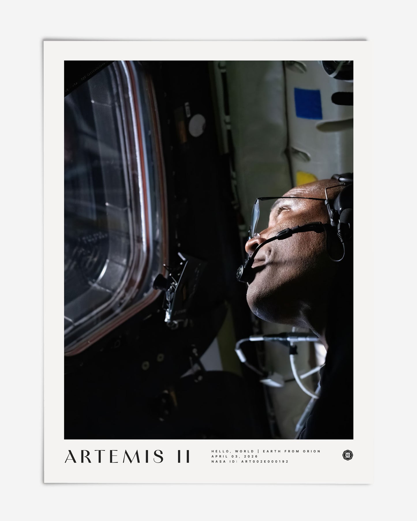 Unframed Artemis II art print showing a color portrait of an astronaut wearing a headset and looking through a spacecraft window.